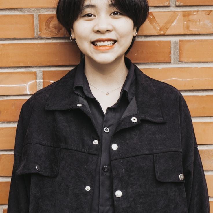 Kaveri Mehta, Lead Design Curator at Bright Garden Collective, reviewing corporate floral arrangements